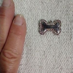 Silvertone dog bone crystal pendant